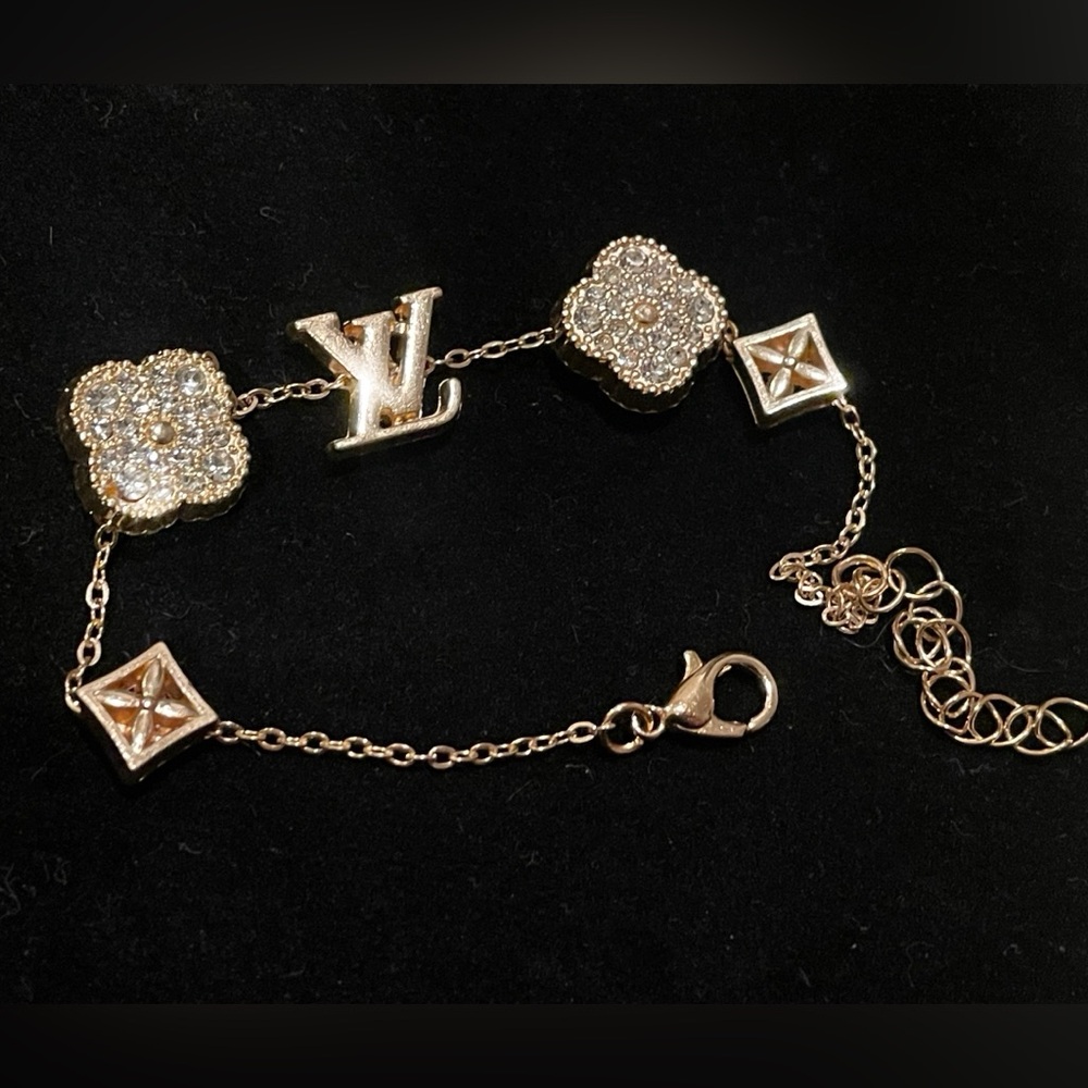 gold crystals monogram logo bracelet pretty to match your bag or purse😍